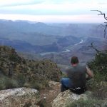 Sitting on the edge of the Grand Canyon